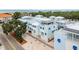 Exterior of the townhomes showcasing architectural details, with solar panels, and landscaping at 1413 Bayshore Blvd # 11, Dunedin, FL 34698