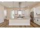 Modern kitchen featuring a central island, sleek appliances, and ample cabinet space for culinary enthusiasts at 1413 Bayshore Blvd # 11, Dunedin, FL 34698
