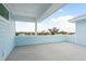 Rooftop deck with an overhang providing shade and neighborhood views at 1413 Bayshore Blvd # 11, Dunedin, FL 34698