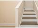 Stairway featuring white risers and stained wood treads at 1413 Bayshore Blvd # 11, Dunedin, FL 34698