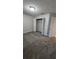 Clean and inviting bedroom featuring a closet, neutral walls and plush carpeting providing a warm atmosphere at 16502 Windsor Park Dr, Lutz, FL 33549