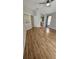 Bedroom with wood-look floors, ceiling fan, and ensuite bathroom at 16502 Windsor Park Dr, Lutz, FL 33549