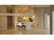 Bright kitchen featuring tile floors, breakfast bar with seating and light wood cabinetry at 16502 Windsor Park Dr, Lutz, FL 33549