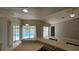 Open kitchen with modern sink and sliding doors leading to the beautiful pool area at 16502 Windsor Park Dr, Lutz, FL 33549