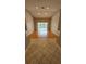 Bright and spacious living room with hardwood floors and sliding doors to the pool area at 16502 Windsor Park Dr, Lutz, FL 33549