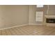 Bright living room features neutral paint, tile floors and a fireplace at 16502 Windsor Park Dr, Lutz, FL 33549