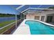 Enclosed pool area featuring an in-ground pool and scenic views at 16502 Windsor Park Dr, Lutz, FL 33549