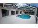 Enclosed pool featuring a geometric in-ground pool and a large deck area, great for entertaining or personal relaxation at 16502 Windsor Park Dr, Lutz, FL 33549