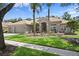Charming home featuring lush landscaping, mature palm trees, and a tile roof at 17818 Arbor Greene Dr, Tampa, FL 33647