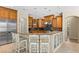 Spacious kitchen with breakfast bar, stainless steel appliances and wooden cabinets at 17818 Arbor Greene Dr, Tampa, FL 33647