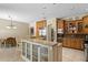 Open-concept kitchen with granite countertops and breakfast bar at 17818 Arbor Greene Dr, Tampa, FL 33647