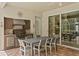 Outdoor kitchen featuring a stainless steel grill, counter space, and dining area with a view at 17818 Arbor Greene Dr, Tampa, FL 33647
