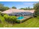 Aerial view of the backyard pool and patio area at 17818 Arbor Greene Dr, Tampa, FL 33647