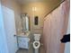 Bathroom including decorative shower curtain and tile floor at 17942 Villa Creek Dr # 17942, Tampa, FL 33647