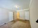 Carpeted bedroom with three doors at 17942 Villa Creek Dr # 17942, Tampa, FL 33647