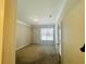 Well-lit bedroom featuring wall-to-wall carpet and double-hung windows at 17942 Villa Creek Dr # 17942, Tampa, FL 33647