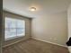 Well-lit bedroom featuring wall-to-wall carpet and double-hung windows at 17942 Villa Creek Dr # 17942, Tampa, FL 33647