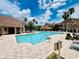Large community pool and patio area with plenty of lounge chairs for relaxing at 17942 Villa Creek Dr # 17942, Tampa, FL 33647