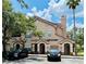 Charming condo with tan exterior, tile roof, and front parking on a sunny day at 17942 Villa Creek Dr # 17942, Tampa, FL 33647