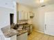 Kitchen with granite countertops, stainless steel appliances, and tile floors at 17942 Villa Creek Dr # 17942, Tampa, FL 33647