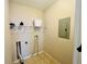 A close-up view inside the laundry room with wire rack at 17942 Villa Creek Dr # 17942, Tampa, FL 33647
