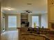 View of Living room with tile floors, workstation, and natural light from kitchen area at 17942 Villa Creek Dr # 17942, Tampa, FL 33647