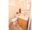 Cozy bathroom featuring a single vanity, standard toilet, and neutral tile flooring at 2060 Saffold Park Dr, Ruskin, FL 33570