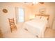 Comfortable bedroom with a ceiling fan, window, and tiled floor at 2060 Saffold Park Dr, Ruskin, FL 33570