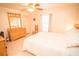 Bright bedroom featuring a window, ceiling fan, tiled flooring and ample closet space at 2060 Saffold Park Dr, Ruskin, FL 33570