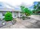 Inviting front entrance with decorative landscaping and charming details enhancing the curb appeal at 2060 Saffold Park Dr, Ruskin, FL 33570