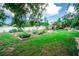 Lush garden area with raised beds, trellises, and verdant greenery creating a serene outdoor space at 2060 Saffold Park Dr, Ruskin, FL 33570