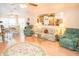 Bright living room boasts comfortable seating, floral accents, and natural light at 2060 Saffold Park Dr, Ruskin, FL 33570