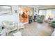 Relaxing sunroom features wicker furniture, exercise equipment, and serene atmosphere at 2060 Saffold Park Dr, Ruskin, FL 33570