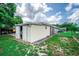 External workshop with an open door, and a maintained lawn at 2060 Saffold Park Dr, Ruskin, FL 33570
