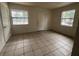 Bright room featuring tile floors and two windows, awaiting personal touches at 2354 7Th S St, St Petersburg, FL 33705