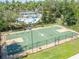 Outdoor basketball court with well-maintained green surface and perimeter fencing at 27546 Stonecreek Way, Wesley Chapel, FL 33544