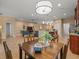Open concept dining area that flows into the living room, kitchen, and main bedroom at 27546 Stonecreek Way, Wesley Chapel, FL 33544