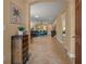 Entrance to living area with tile flooring and neutral color palette at 27546 Stonecreek Way, Wesley Chapel, FL 33544