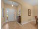 Welcoming foyer featuring neutral tiles and an arched entryway at 27546 Stonecreek Way, Wesley Chapel, FL 33544