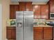 Modern kitchen features stainless steel refrigerator, matching appliances, and beautiful cabinets at 27546 Stonecreek Way, Wesley Chapel, FL 33544