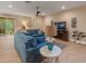 Comfortable living room with ample seating, TV, and sliding glass doors at 27546 Stonecreek Way, Wesley Chapel, FL 33544
