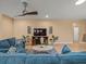 Cozy living room with neutral walls, entertainment center, and tile floors at 27546 Stonecreek Way, Wesley Chapel, FL 33544