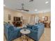 Spacious living room with tile floors, TV, and comfortable seating at 27546 Stonecreek Way, Wesley Chapel, FL 33544