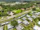 An aerial view of a well-maintained home in a beautiful neighborhood, showcasing lush landscaping and a tranquil residential setting at 301 Kings Blvd # 130, Sun City Center, FL 33573