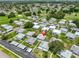 An aerial view of a well-maintained home with tidy landscaping, and parking close by, nestled in a quiet, residential community at 301 Kings Blvd # 130, Sun City Center, FL 33573