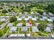 An aerial view of a charming home with lush landscaping in a quiet neighborhood, boasting a serene and inviting atmosphere at 301 Kings Blvd # 130, Sun City Center, FL 33573