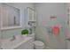 Cozy bathroom features a vanity, mirror, toilet, and decorative elements creating a functional space at 301 Kings Blvd # 130, Sun City Center, FL 33573