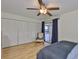 Spacious bedroom features a ceiling fan, wood floors, closet space, and access to an outdoor area at 301 Kings Blvd # 130, Sun City Center, FL 33573