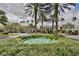 An ornate community entrance with beautiful palm trees and landscaping, ensuring a grand sense of arrival at 301 Kings Blvd # 130, Sun City Center, FL 33573