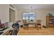 Comfortable dining space with hardwood floors and a simple chandelier at 301 Kings Blvd # 130, Sun City Center, FL 33573